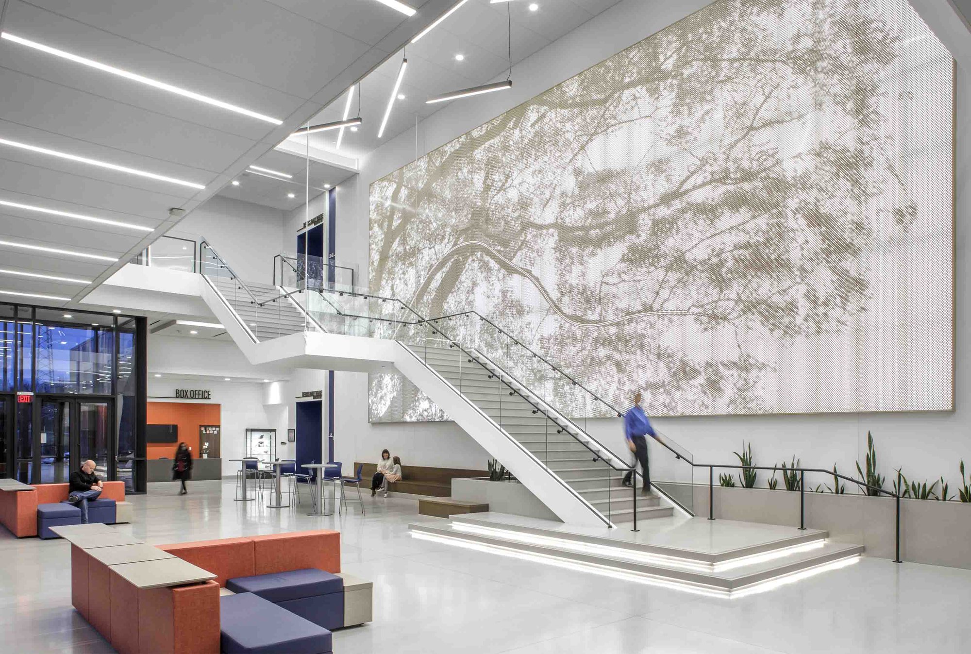 Arktura Vapor Graphic Perf tree wall above the lobby staircase at Kirkwood Performing Arts Center