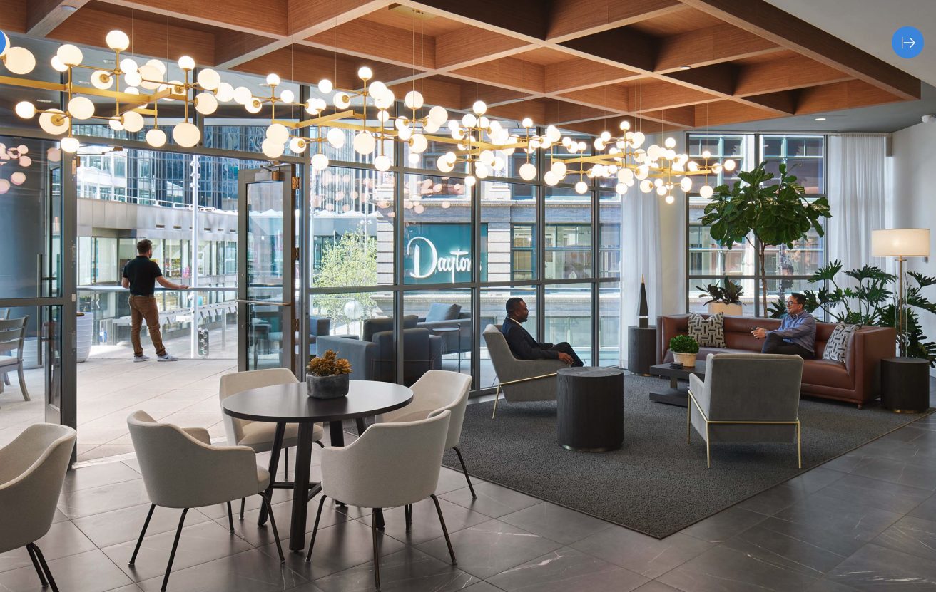 Arktura geometric ceiling panels and cluster lighting in a modern lobby